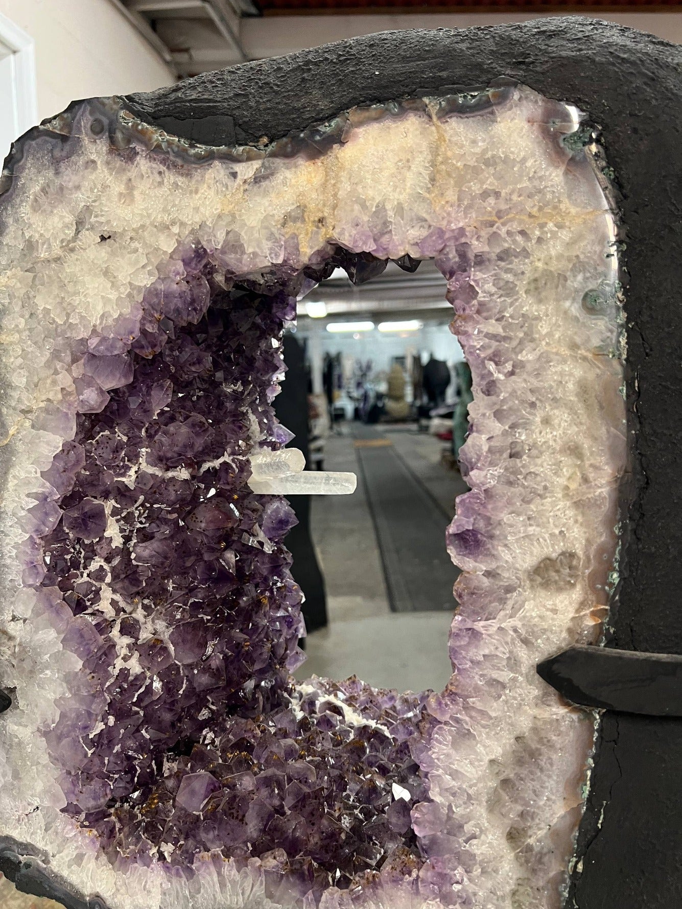 Beautiful Geode cut with clusters and points inside the amethyst tower on stand – Full open face view