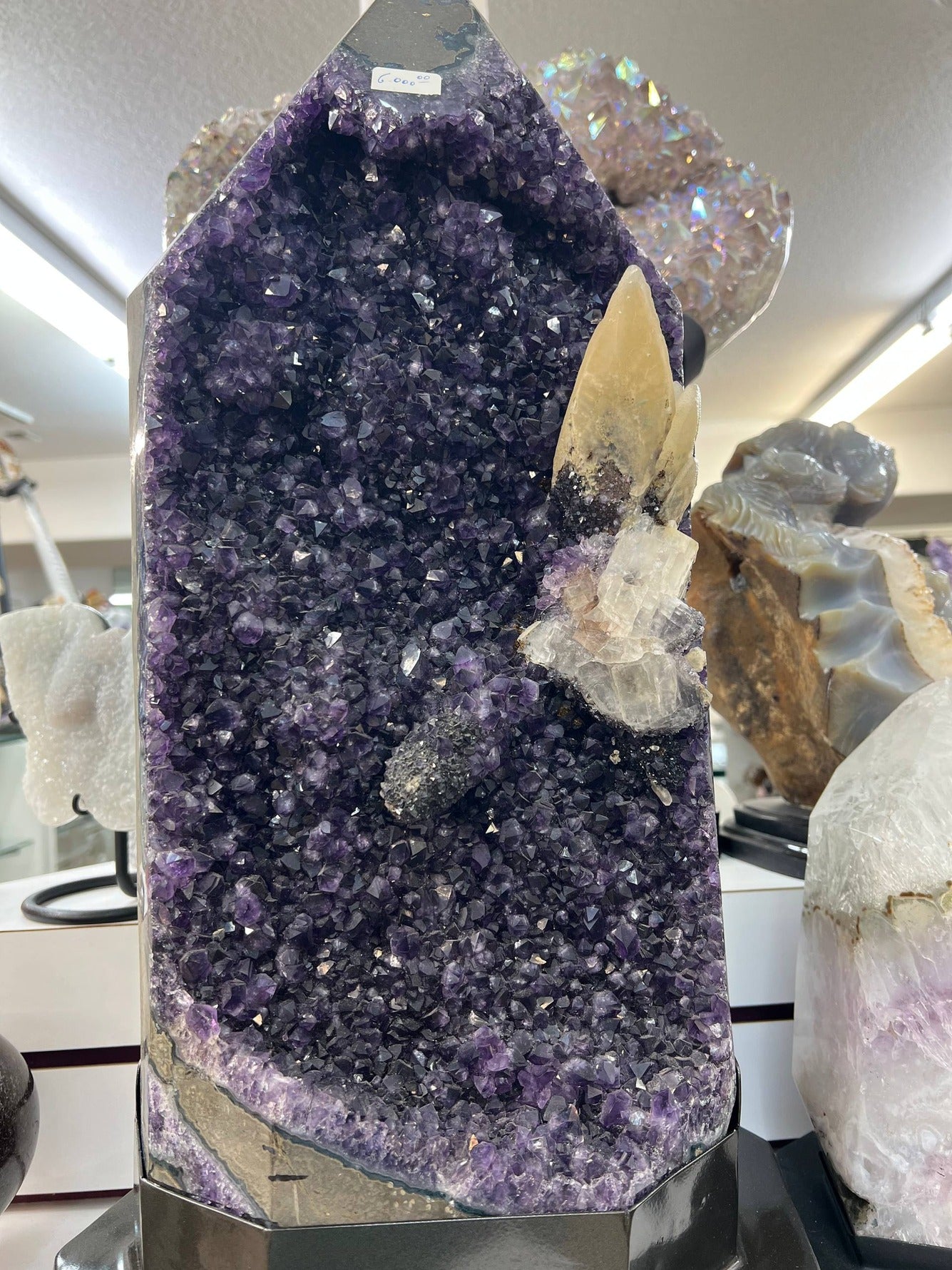 Amethyst cathedral with calcite on stand – view 2