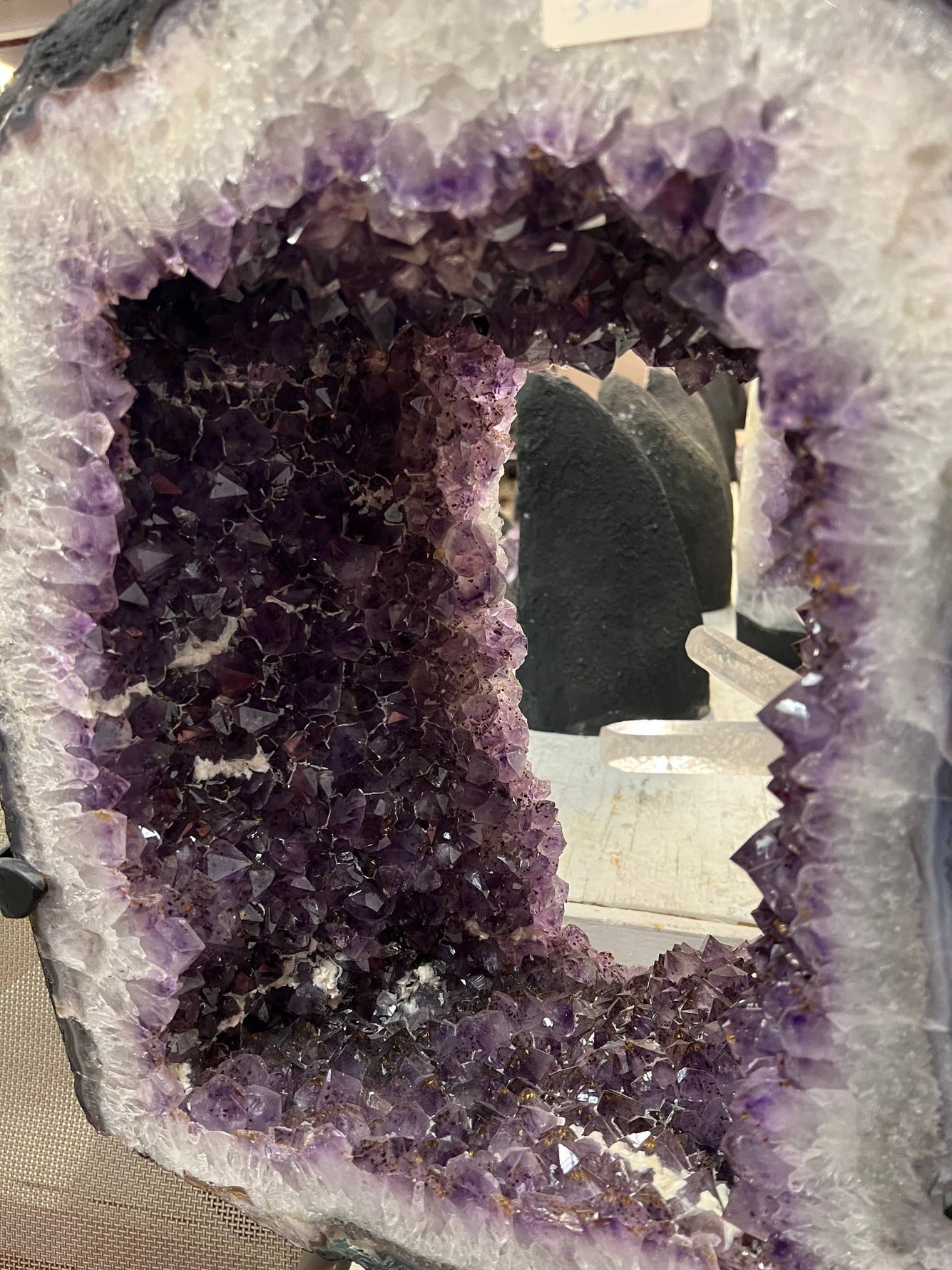 Beautiful Geode cut with clusters and points inside the amethyst tower on stand – Deep purple crystal cavity