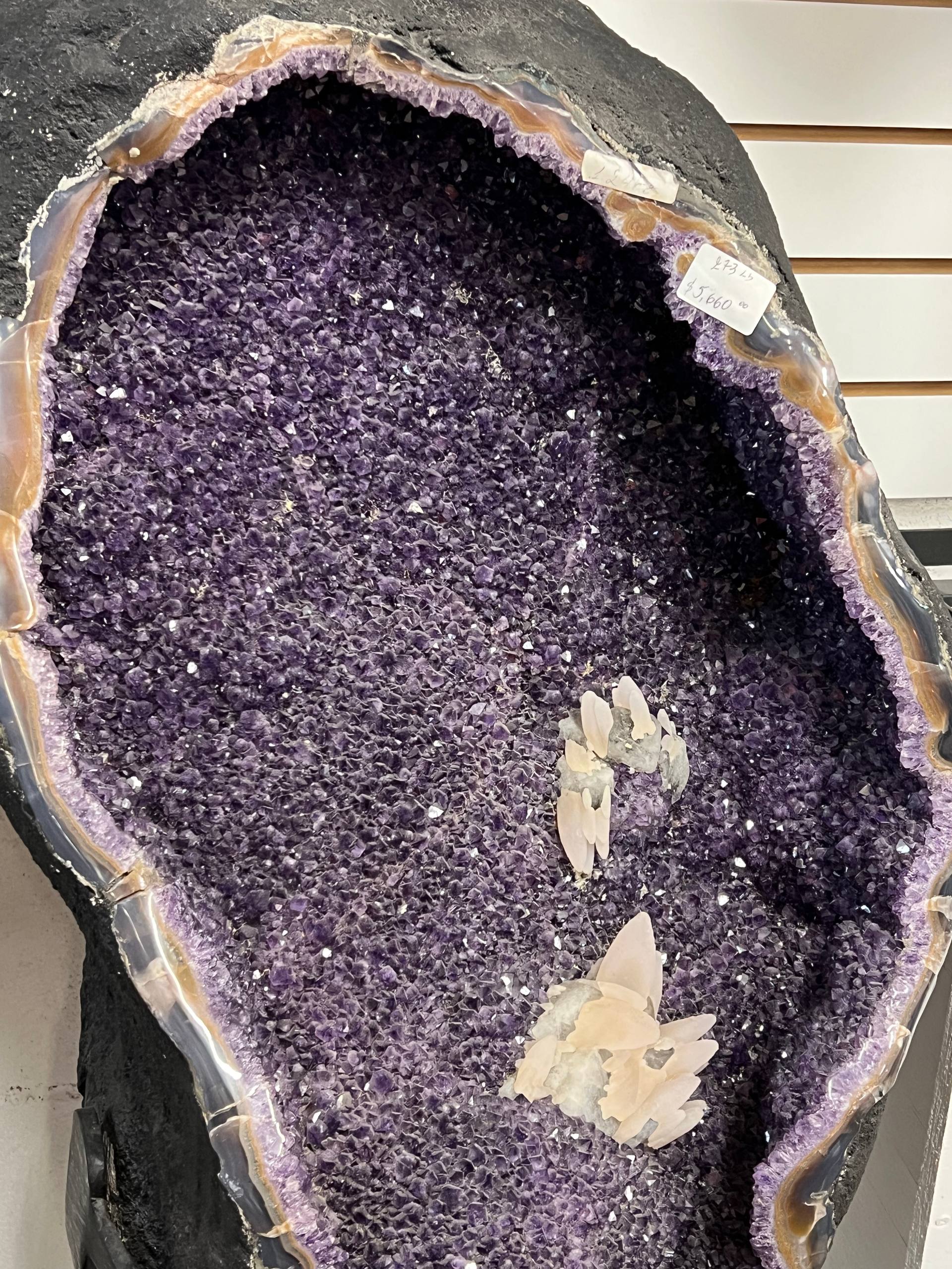 Large amethyst geode with calcite on stands – view 2