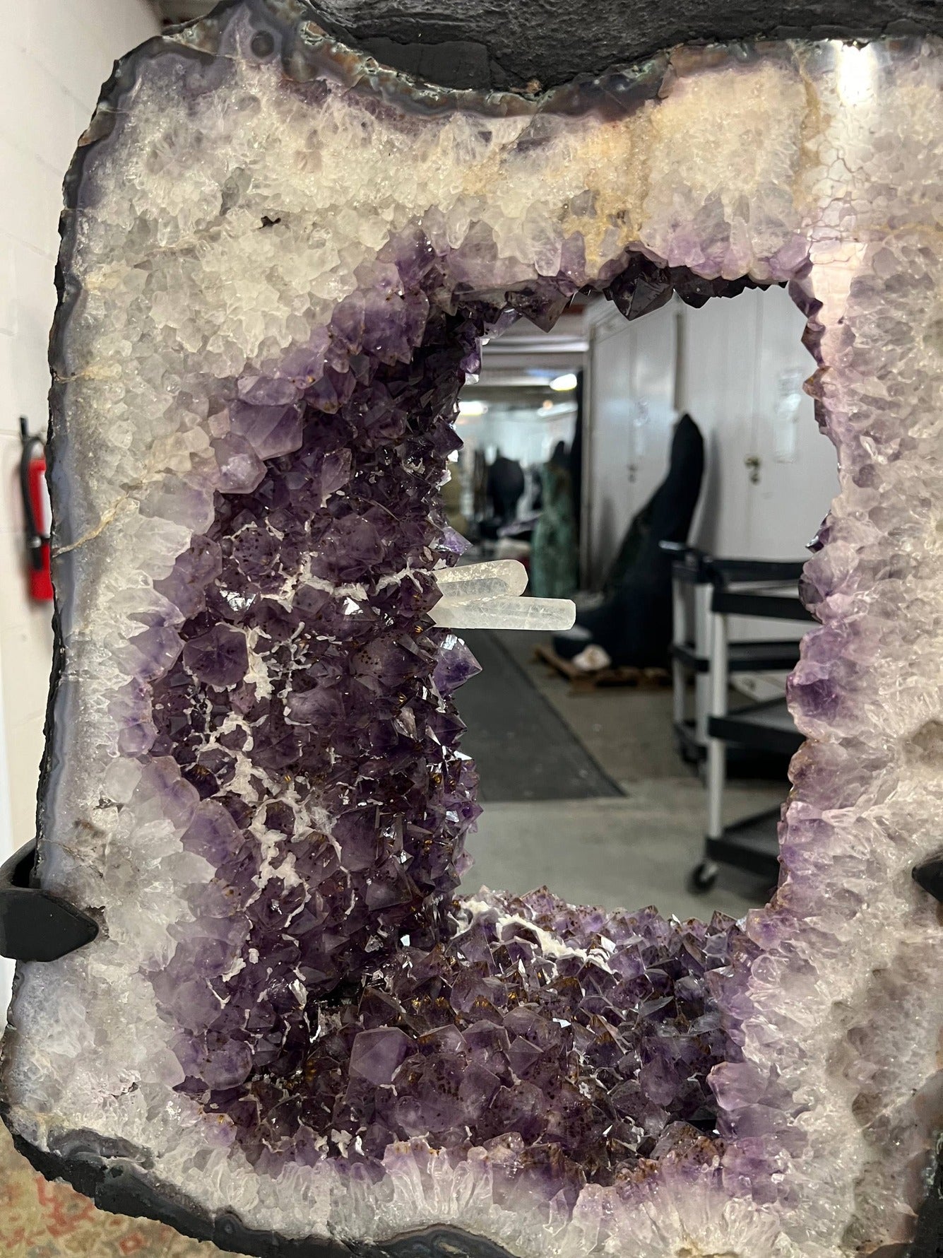 Beautiful Geode cut with clusters and points inside the amethyst tower on stand – Open cavity interior