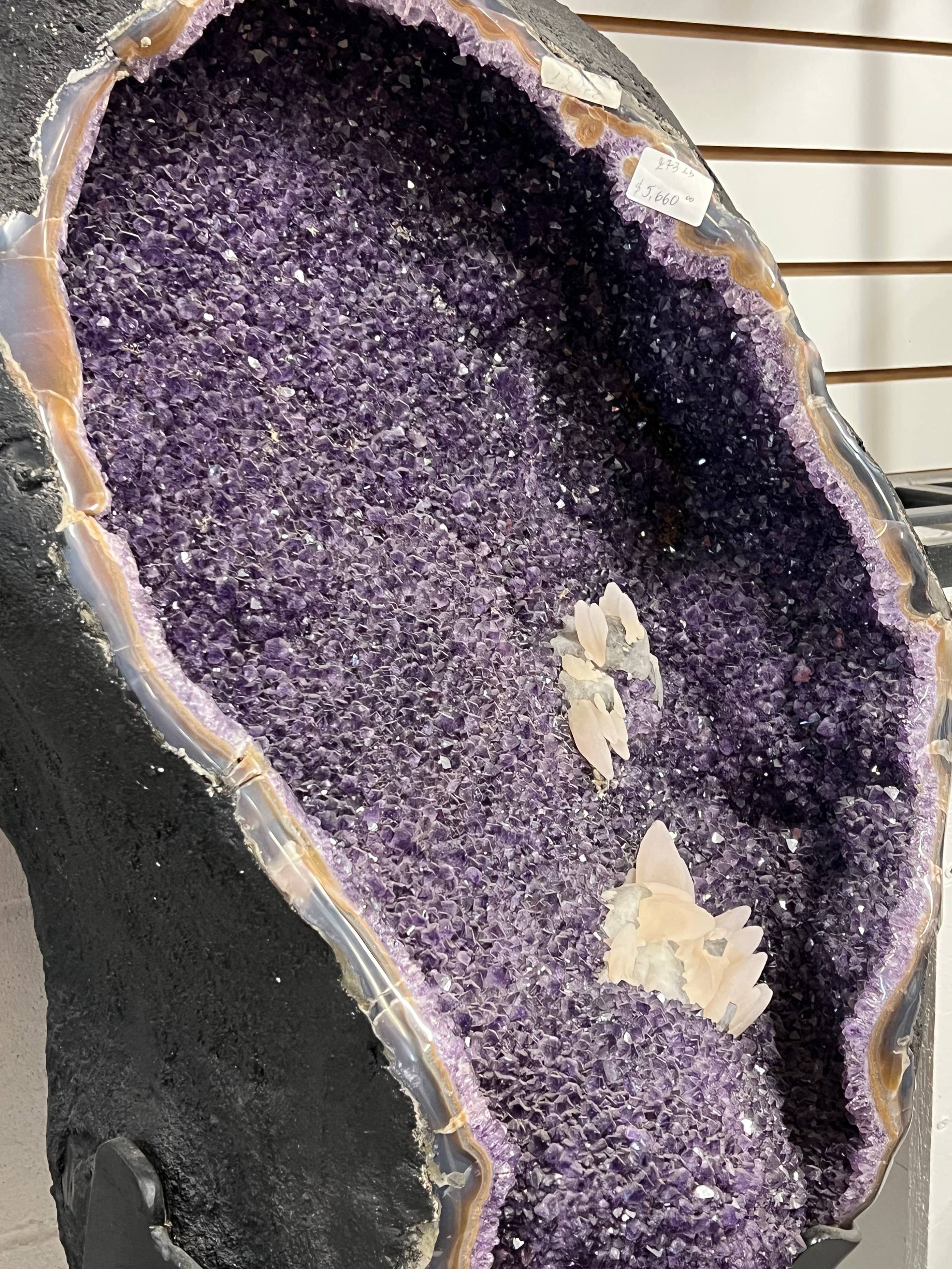 Large amethyst geode with calcite on stands – view 1