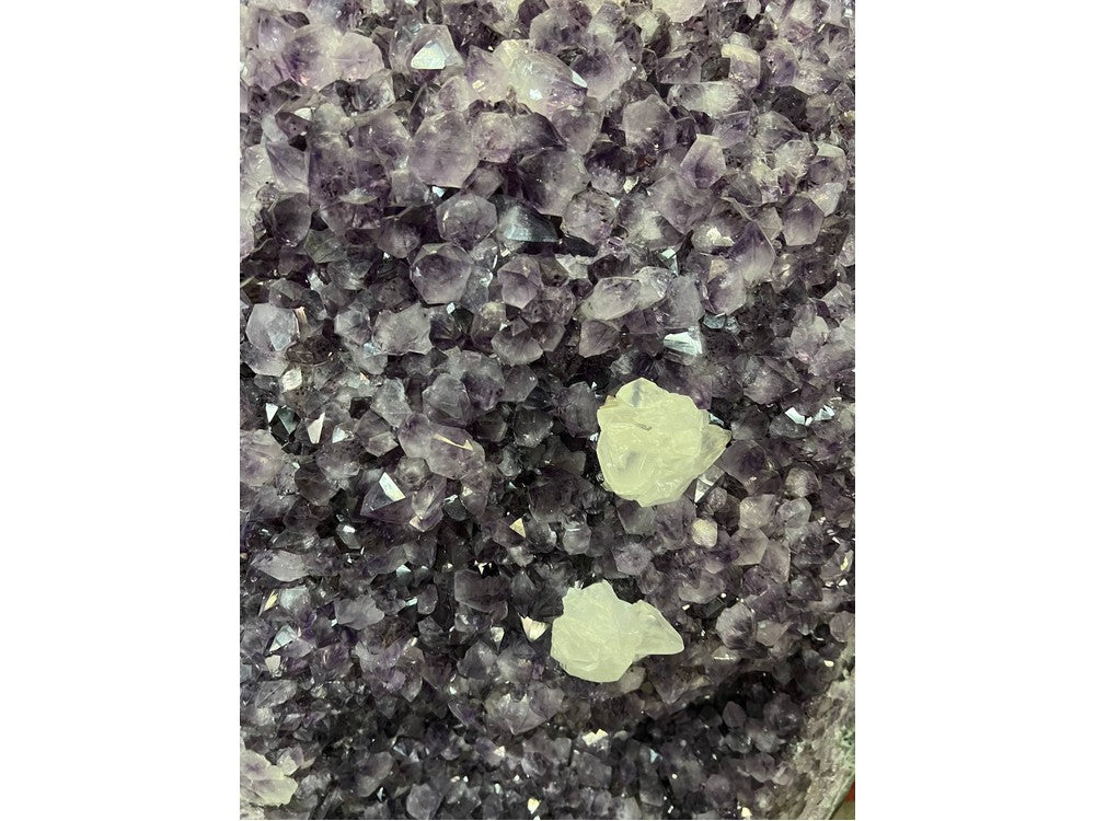 Amethyst geode with calcite inclusions — full view