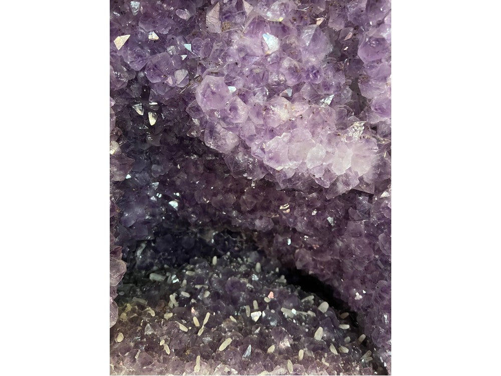 Amethyst geode interior — violet crystals and calcite inclusions