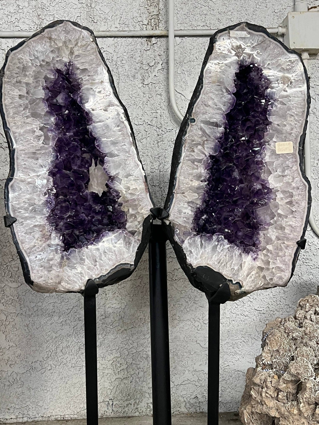 Amethyst Geode Pair on Stands – lower angle view