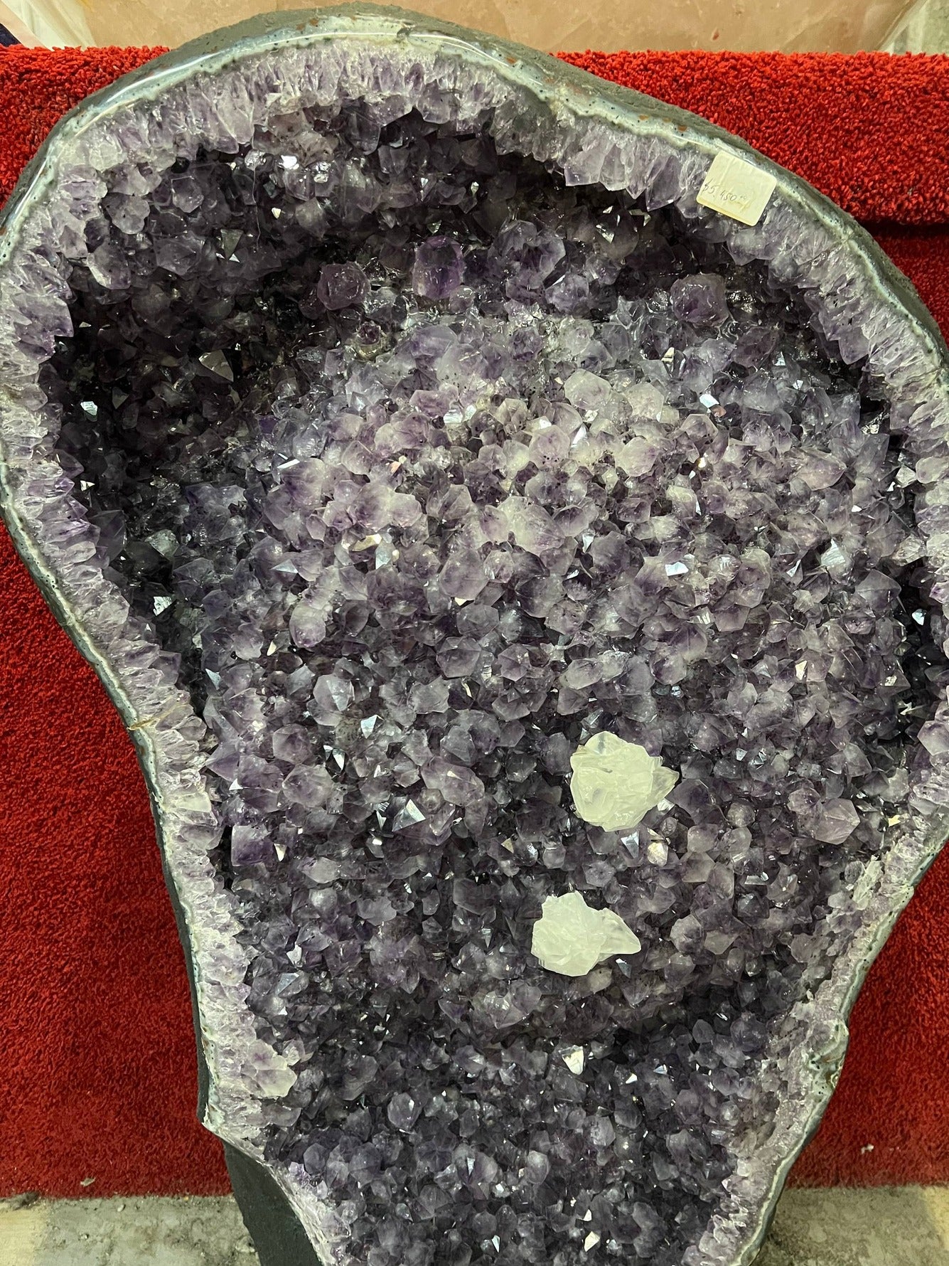 Amethyst geode with calcite crystals – view 1