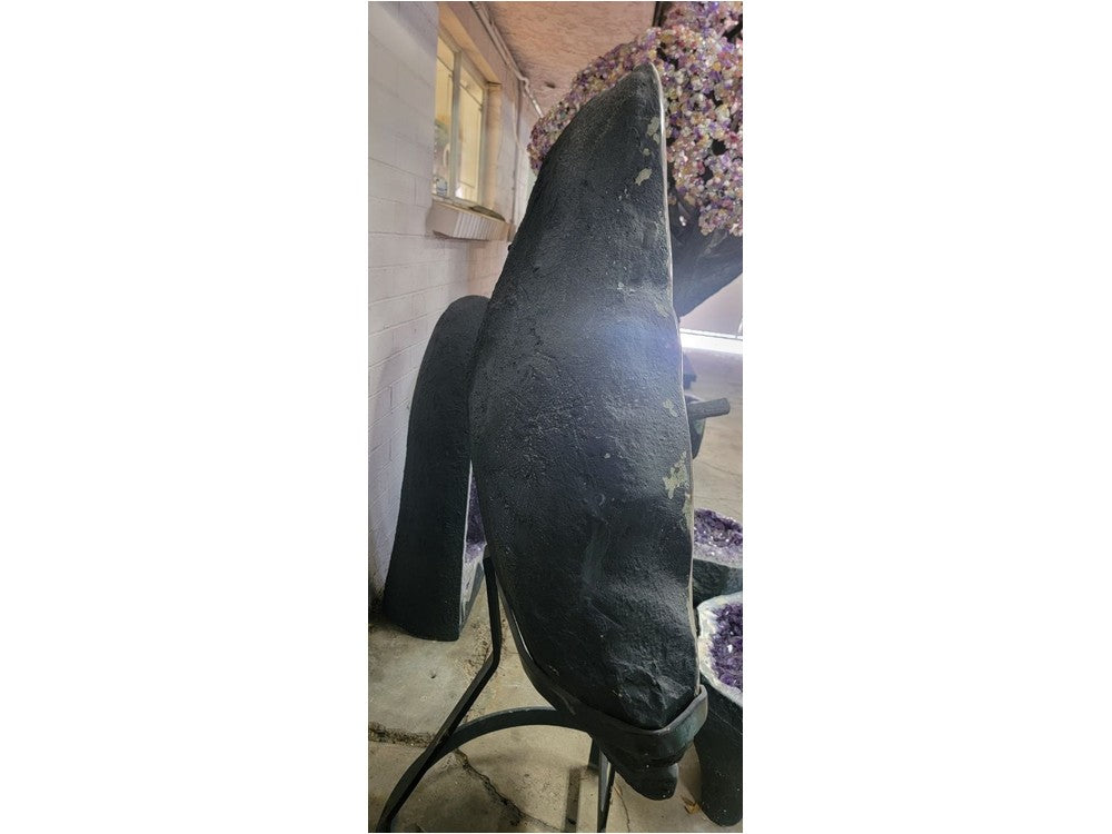 Amethyst geode back view — natural basalt outer shell