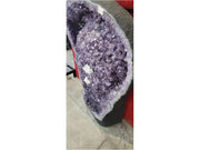 Large amethyst geode with white calcite formation — full view