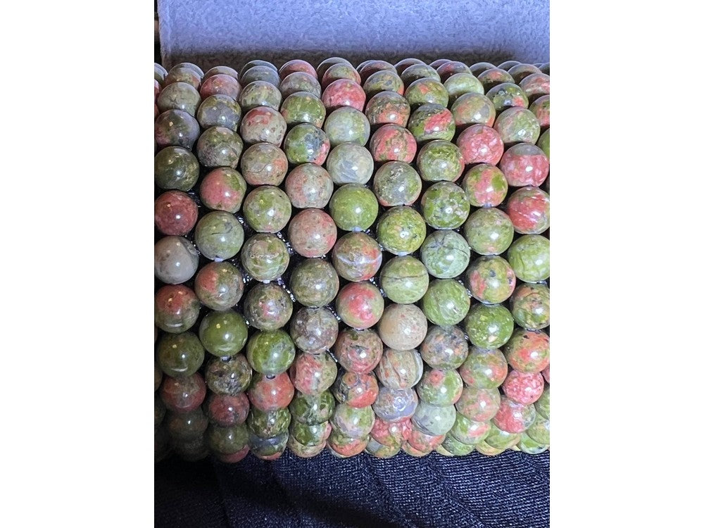 Stack of Mookite Jasper bracelets with polished round gemstone beads