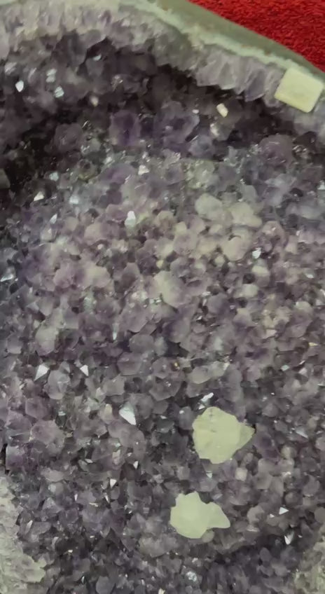 Amethyst geode with calcite crystals – video