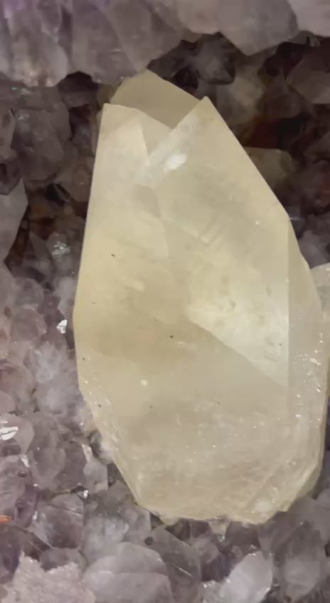 Amethyst geode with large calcite