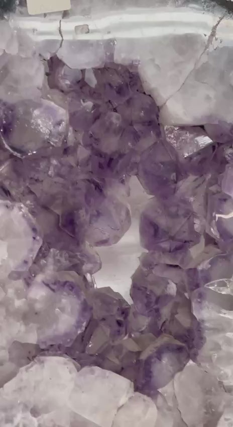 Amethyst geode slabs on stand